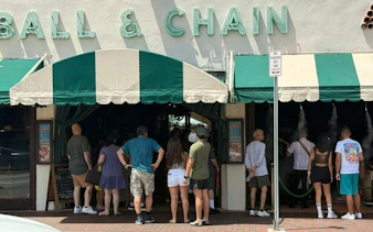 Visitors entering Ball & Chain on Calle Ocho, Miami, during Little Havana guided tour.
