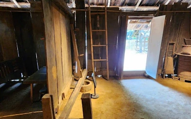 Traditional wooden interior in Sapa, Vietnam, part of guided drive and trek experience.