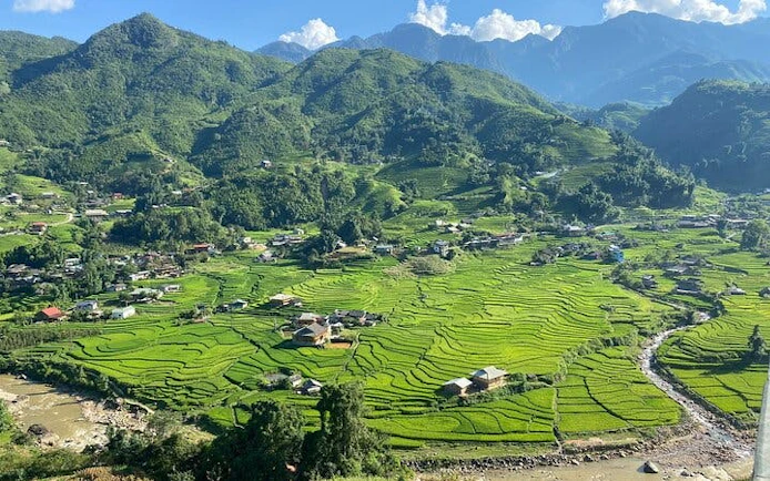 Sapa rice terraces and mountains on a 21km guided trail-running tour.