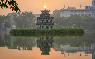 Turtle Tower on Hoan Kiem Lake at sunset, Hanoi Old Quarter.