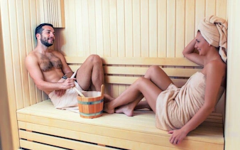 Couple relaxing in a sauna during Turkish Bath Experience in Sharm El Sheikh.