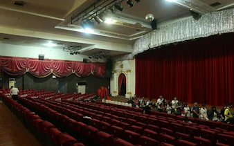 Golden Dome Cabaret theater interior with red seats and stage, Bangkok.