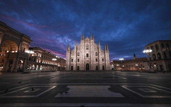 Milan Cathedral at dusk during self-guided walking tour on mobile app.