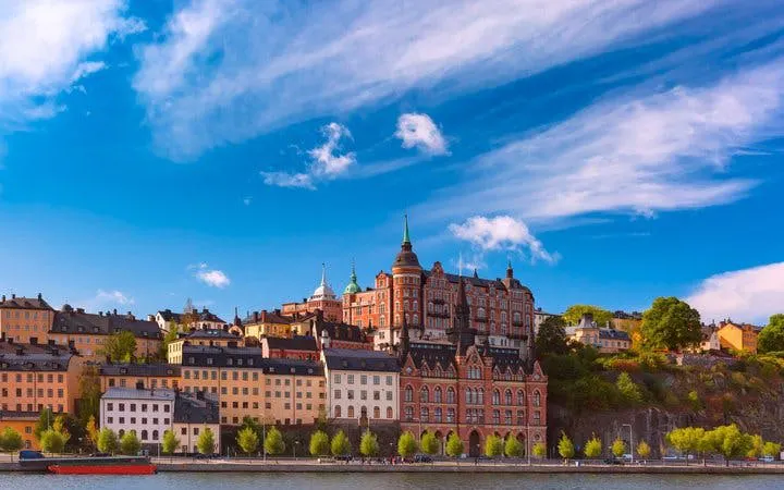 Historic buildings along Stockholm waterfront on self-guided walking tour route.