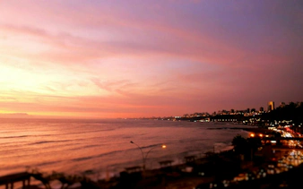 Sunset view of Lima's coastline from Barranco during a self-guided audio walking tour.
