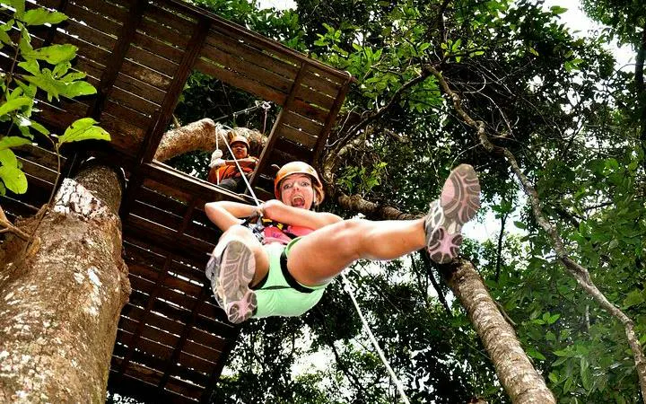 Ziplining through jungle canopy in Chiang Mai, Thailand.