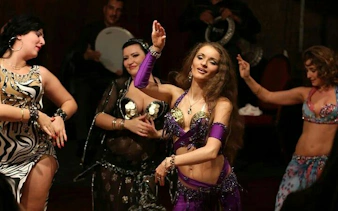 Cabaret dancers performing at a night show with dinner in Hurghada.