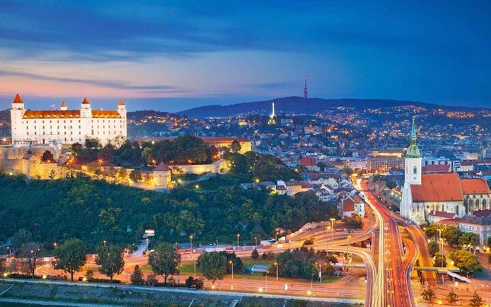 Bratislava Castle and St. Martin's Cathedral at dusk during self-guided walking tour.