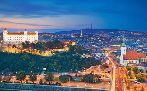 Bratislava Castle and St. Martin's Cathedral at dusk during self-guided walking tour.