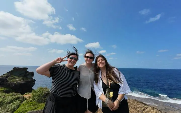 Tourists enjoying the view at Ishigaki Island's coastline, Okinawa.