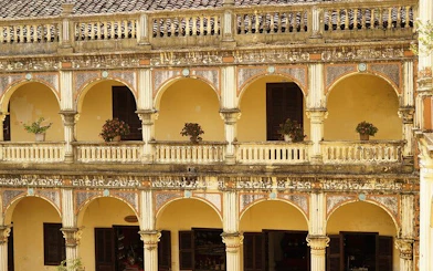 Two-story colonial building with arched balconies at Bac Ha Market, Sapa.
