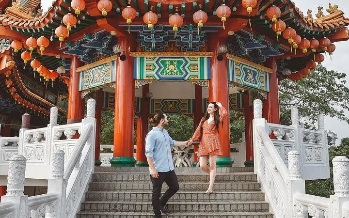 Couple exploring Thean Hou Temple in Kuala Lumpur during Batu Caves tour.