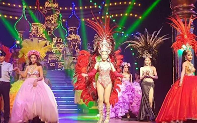Performers in vibrant costumes on stage at Alcazar Cabaret Show, Pattaya.