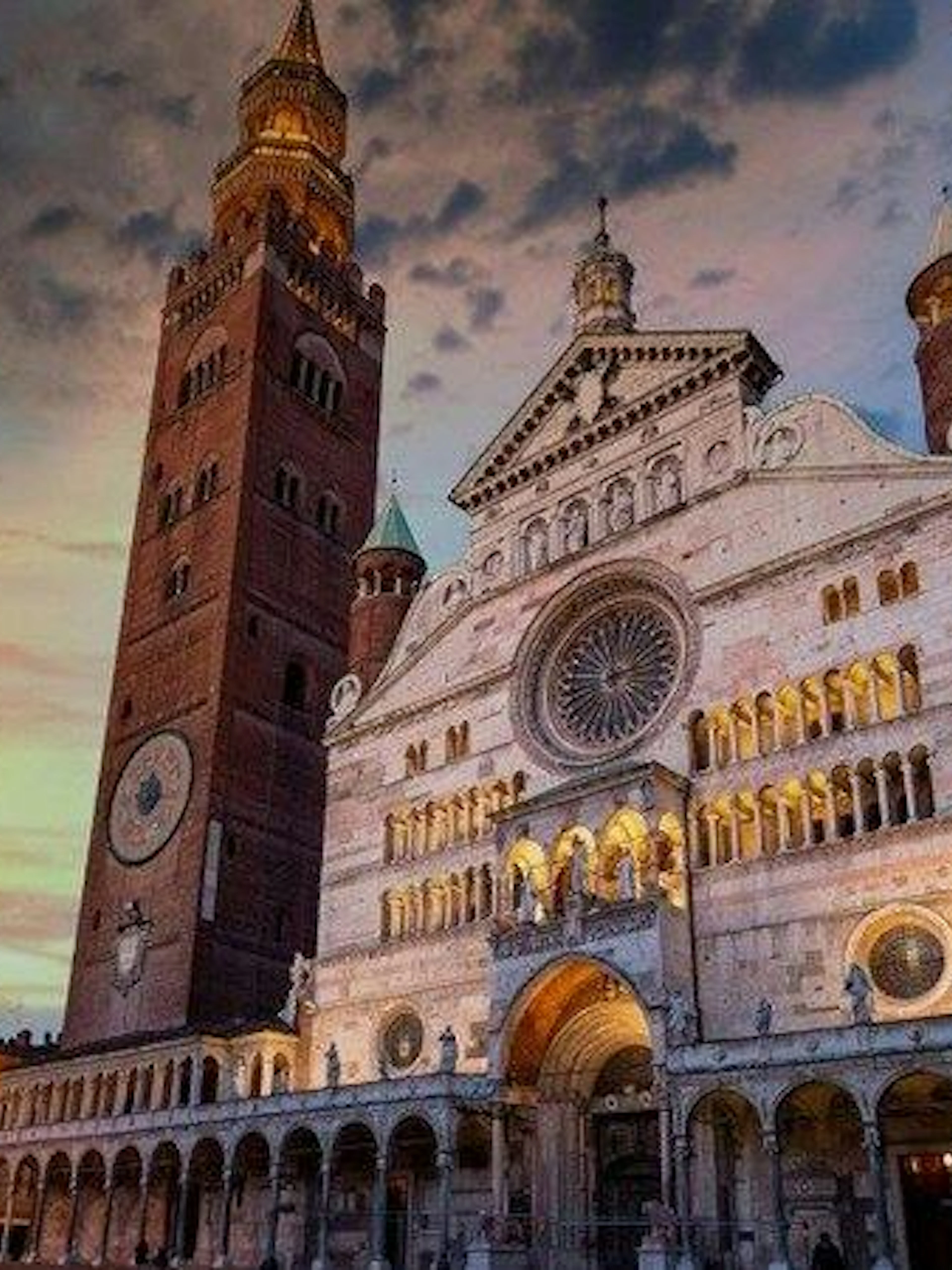 Cremona Cathedral and Torrazzo tower at sunset, part of self-guided audio walking tour.