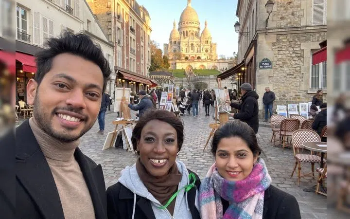Montmartre street with Sacré-Cœur Basilica in background during guided walking tour.