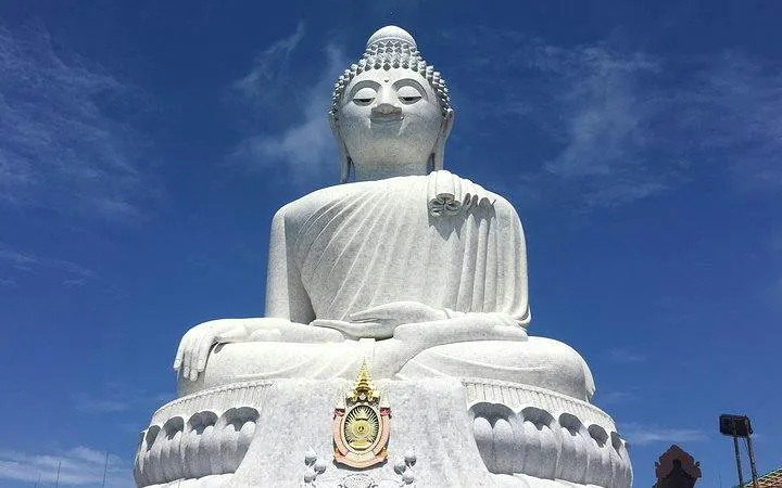 Big Buddha statue under blue sky, Phuket, part of private island highlights tour.
