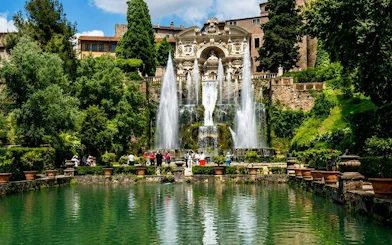 Fountain at Villa d'Este in Tivoli with tourists exploring the gardens.