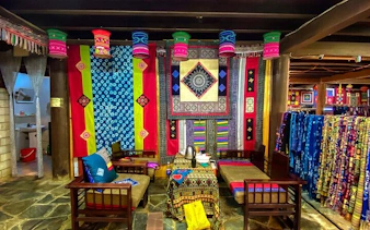 Traditional textiles and decor in a Sapa cultural center during a private tour.