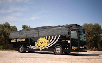 Tour bus for Valle d'Itria trip from Bari, featuring Polignano, Ostuni, Locorotondo.