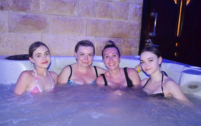 Women enjoying a traditional Moroccan hammam in Marrakech spa.