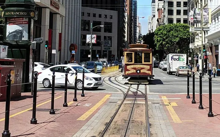 San Francisco cable car on city street during Gold Rush exploration game.
