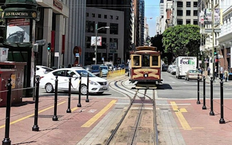 San Francisco cable car on city street during Gold Rush exploration game.