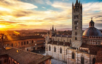 Siena Cathedral at sunset during self-guided walking tour on mobile app.