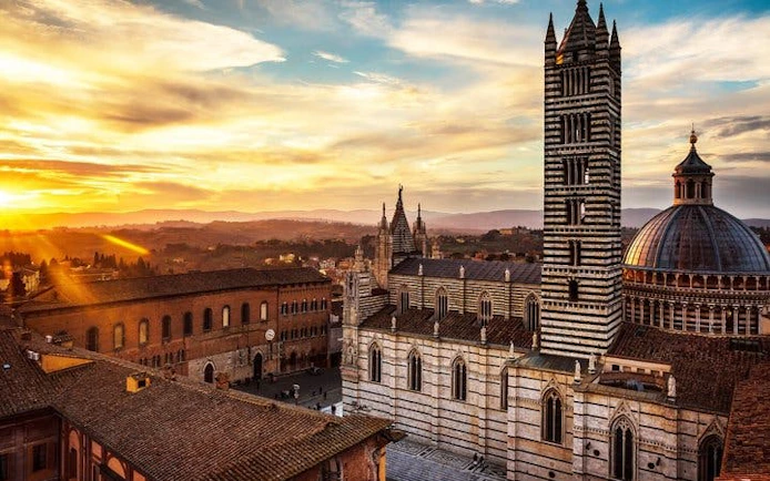 Siena Cathedral at sunset during self-guided walking tour on mobile app.