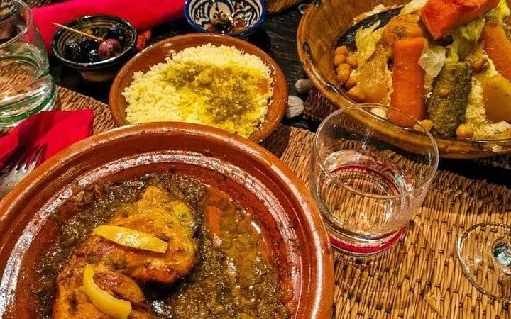 Moroccan tagine and couscous served during cooking class in Marrakesh.