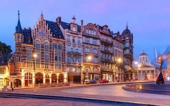 Historic buildings in Brussels city center at dusk, part of a self-guided walking tour.