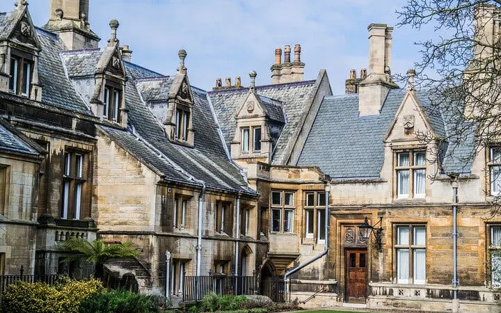 Historic stone buildings in Cambridge, part of a self-guided walking tour.