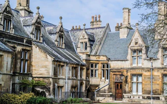 Historic stone buildings in Cambridge, part of a self-guided walking tour.