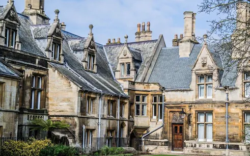 Historic stone buildings in Cambridge, part of a self-guided walking tour.