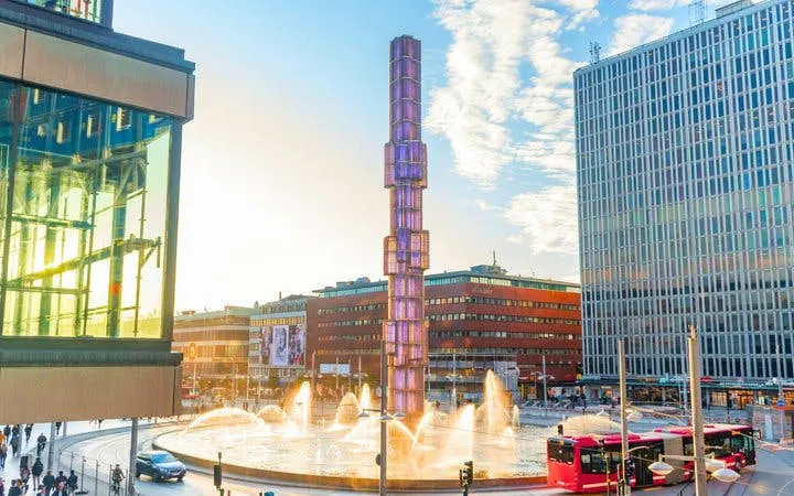 Sergels Torg fountain and glass obelisk in Stockholm city center during a self-guided walking tour.