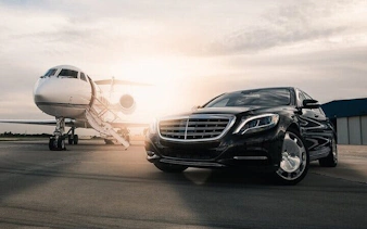 Luxury car and private jet at Sharm El Sheikh airport for hotel transfer.