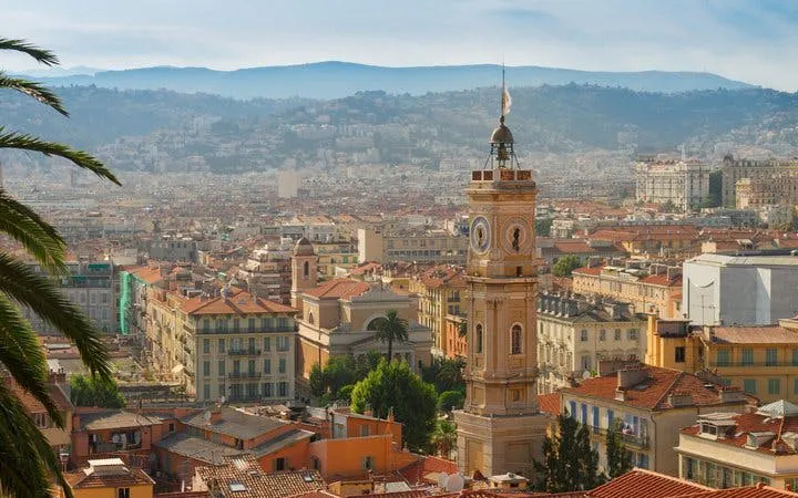 Clock tower overlooking Nice cityscape on a self-guided walking tour.