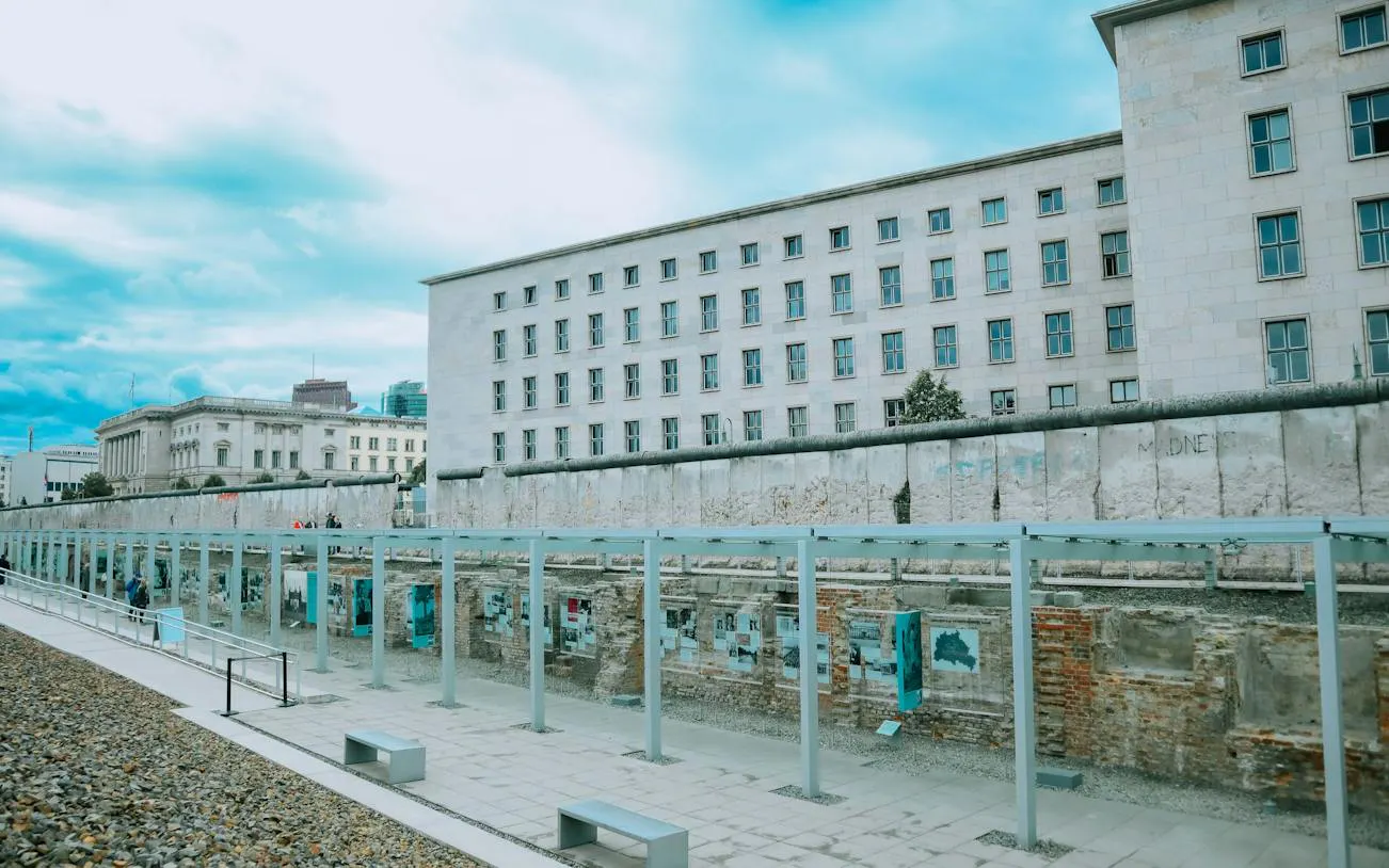 Berlin Wall remnants at Topography of Terror, Berlin, with historical exhibits displayed.