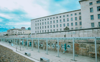 Berlin Wall remnants at Topography of Terror, Berlin, with historical exhibits displayed.