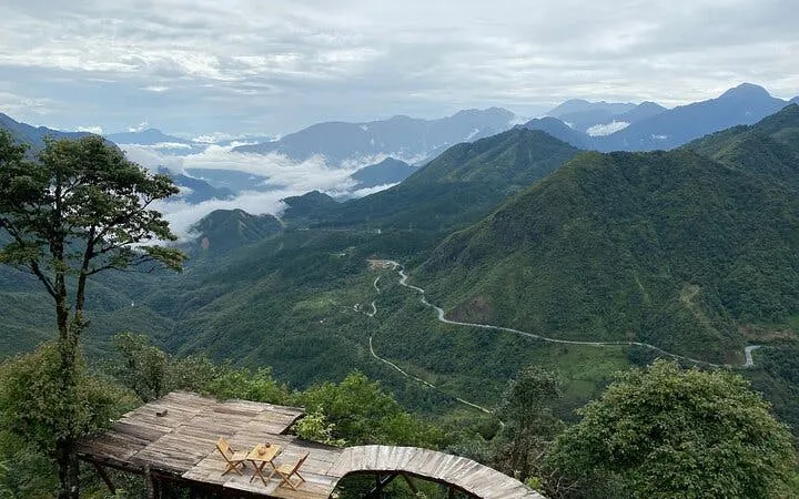 Sa Pa mountain view with winding road and wooden deck, Vietnam.