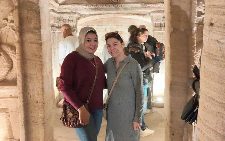Visitors exploring the Catacombs of Kom El Shoqafa in Alexandria.