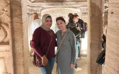 Visitors exploring the Catacombs of Kom El Shoqafa in Alexandria.