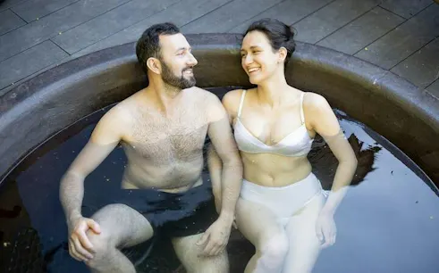 Couple relaxing in a jacuzzi at a Moroccan bath in Hurghada.