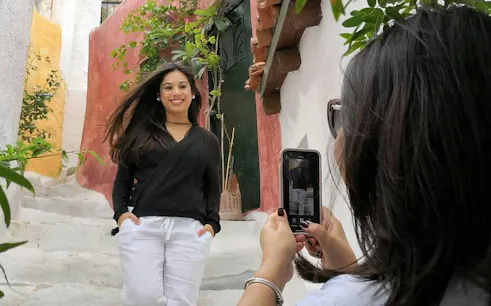 Woman posing for a photo on a charming street during Athens Instagram Photo Walking Tour.