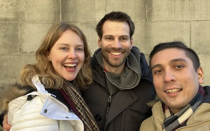 Three people smiling during Einstein's Zurich self-guided city exploration game.