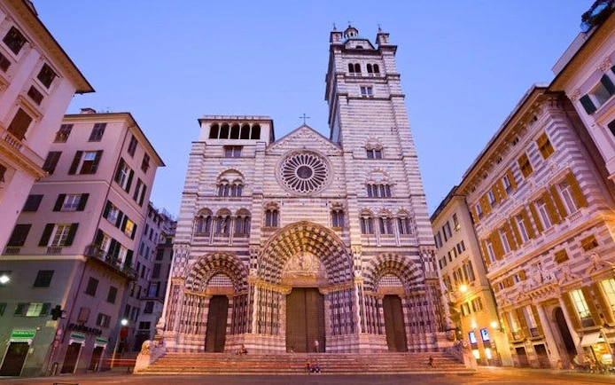 Genoa Cathedral facade at dusk on self-guided walking tour.