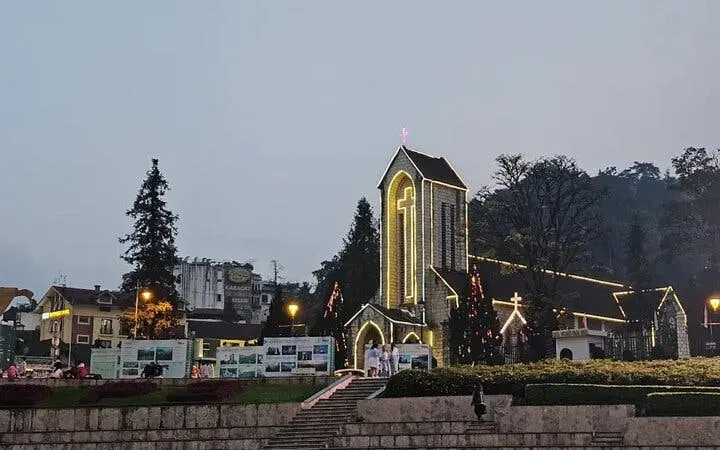 Stone Church in Sapa illuminated at dusk, part of the Sapa Private Cultural Tour.