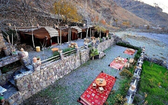 Berber tents and rugs in Atlas Mountains village, Marrakesh tour.