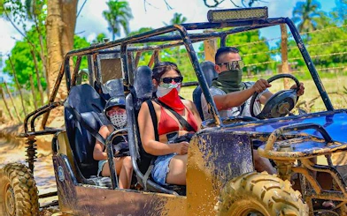 Tourists riding a jungle buggy on a guided tour in Punta Cana.