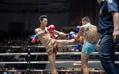 Muay Thai fighters in action at Rajadamnern Stadium, Bangkok.