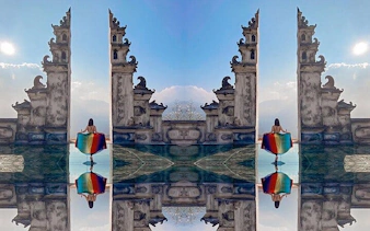 Ancient stone gate with reflection in Sapa, Vietnam, part of private car tour to Lonely Tree and Heaven's Gate.